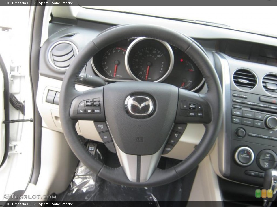 Sand Interior Steering Wheel for the 2011 Mazda CX-7 i Sport #46096958