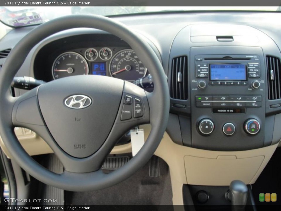 Beige Interior Dashboard for the 2011 Hyundai Elantra Touring GLS #46141417
