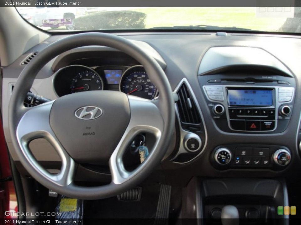 Taupe Interior Dashboard for the 2011 Hyundai Tucson GL #46142182