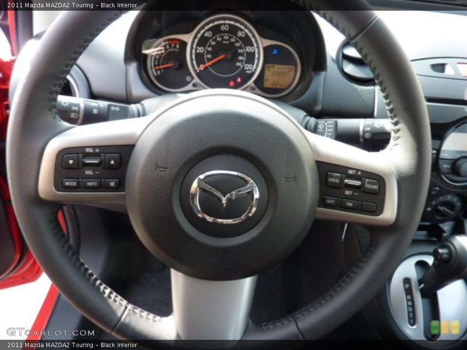Black Interior Steering Wheel for the 2011 Mazda MAZDA2 Touring #46194344