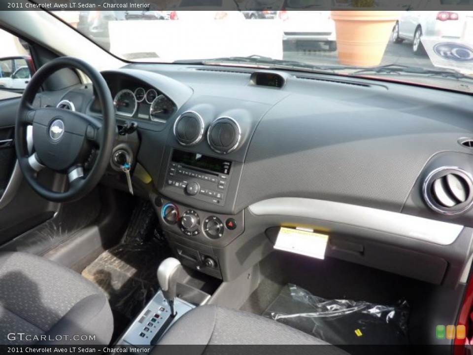 Charcoal Interior Dashboard for the 2011 Chevrolet Aveo LT Sedan #46223960
