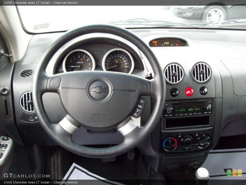 Charcoal Interior Dashboard for the 2006 Chevrolet Aveo LT Sedan #46319538