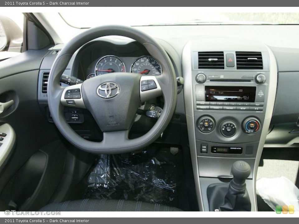 Dark Charcoal Interior Dashboard for the 2011 Toyota Corolla S #46337910