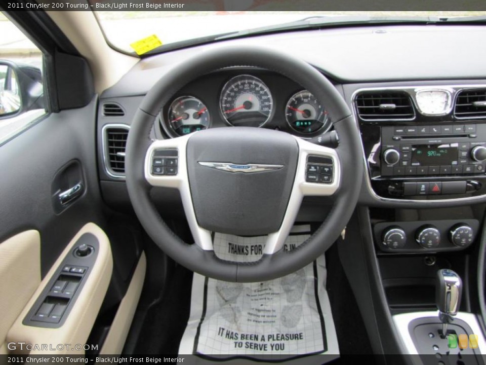 Black/Light Frost Beige Interior Steering Wheel for the 2011 Chrysler 200 Touring #46343196
