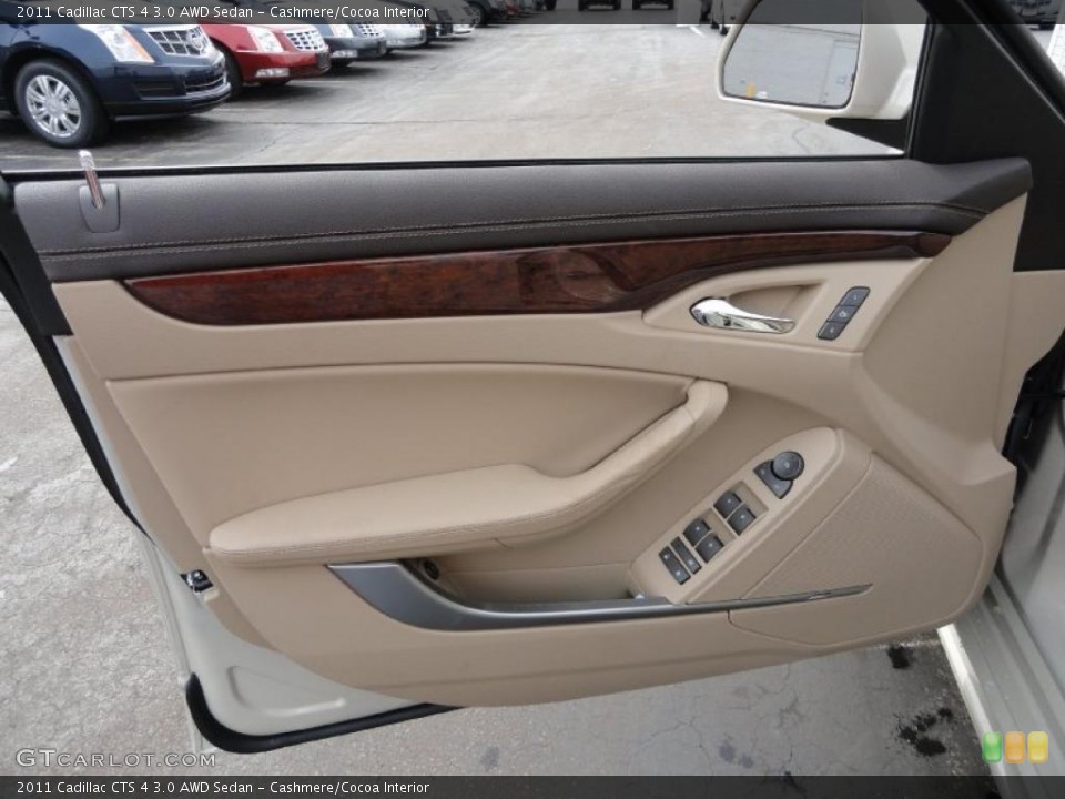Cashmere/Cocoa Interior Door Panel for the 2011 Cadillac CTS 4 3.0 AWD Sedan #46470630