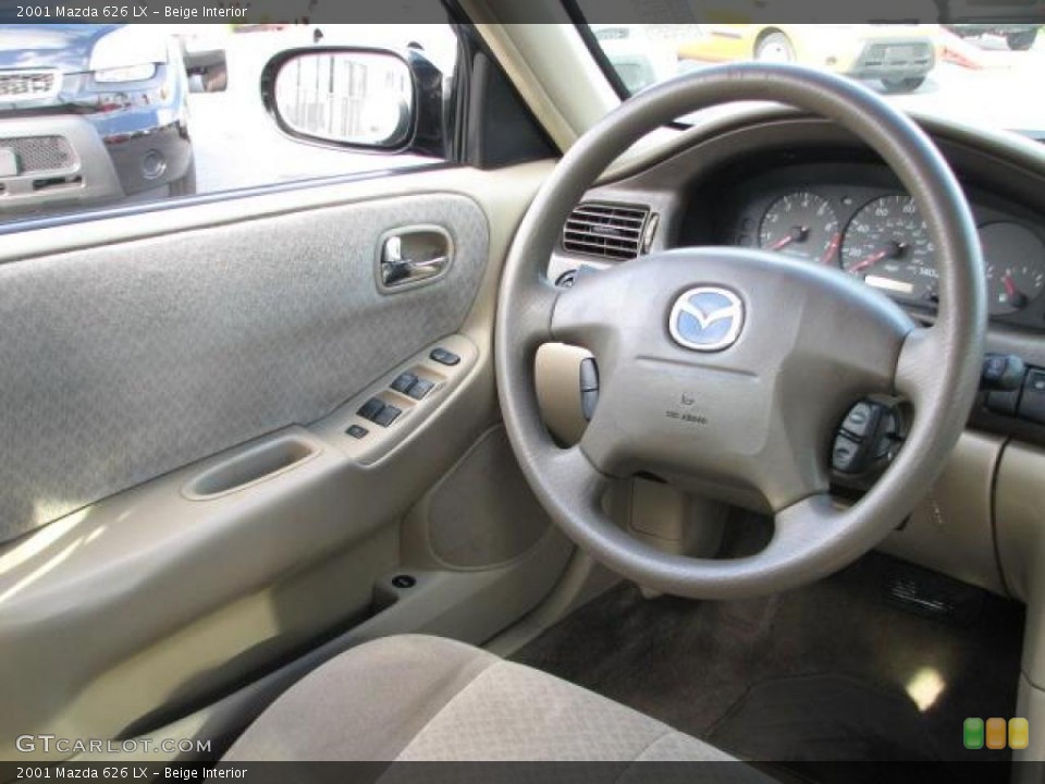 Beige Interior Steering Wheel for the 2001 Mazda 626 LX #46482426