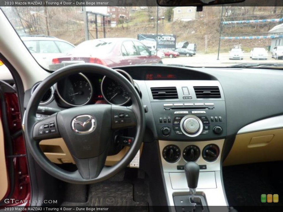 Dune Beige Interior Dashboard for the 2010 Mazda MAZDA3 i Touring 4 Door #46529793