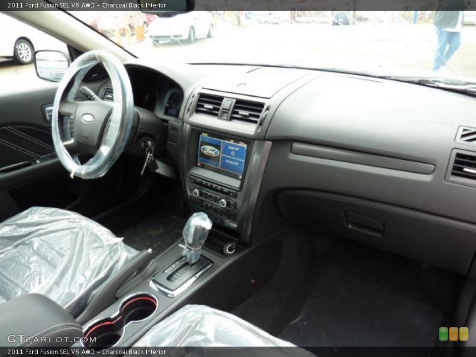 Charcoal Black Interior Dashboard for the 2011 Ford Fusion SEL V6 AWD #46607497