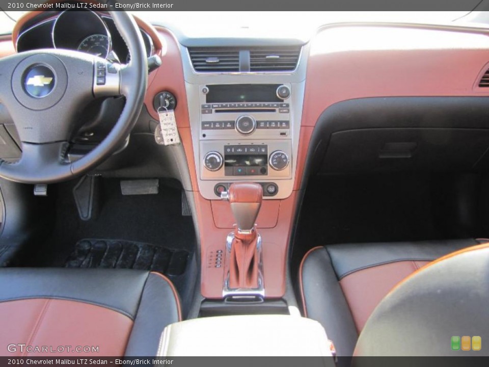 Ebony/Brick Interior Dashboard for the 2010 Chevrolet Malibu LTZ Sedan #46614862