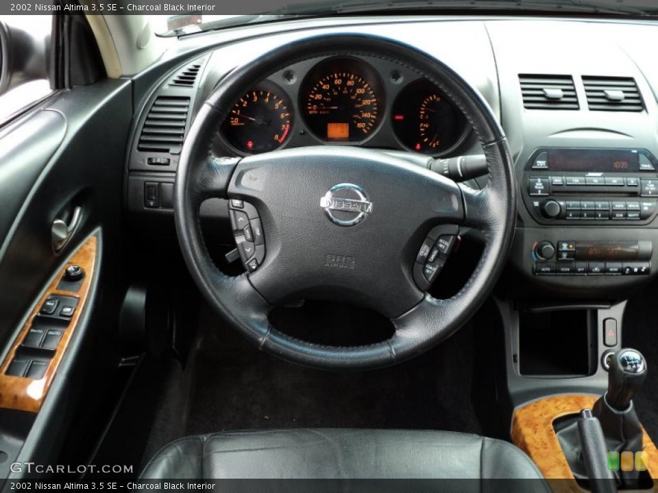 Charcoal Black Interior Steering Wheel for the 2002 Nissan Altima 3.5 SE #46623535