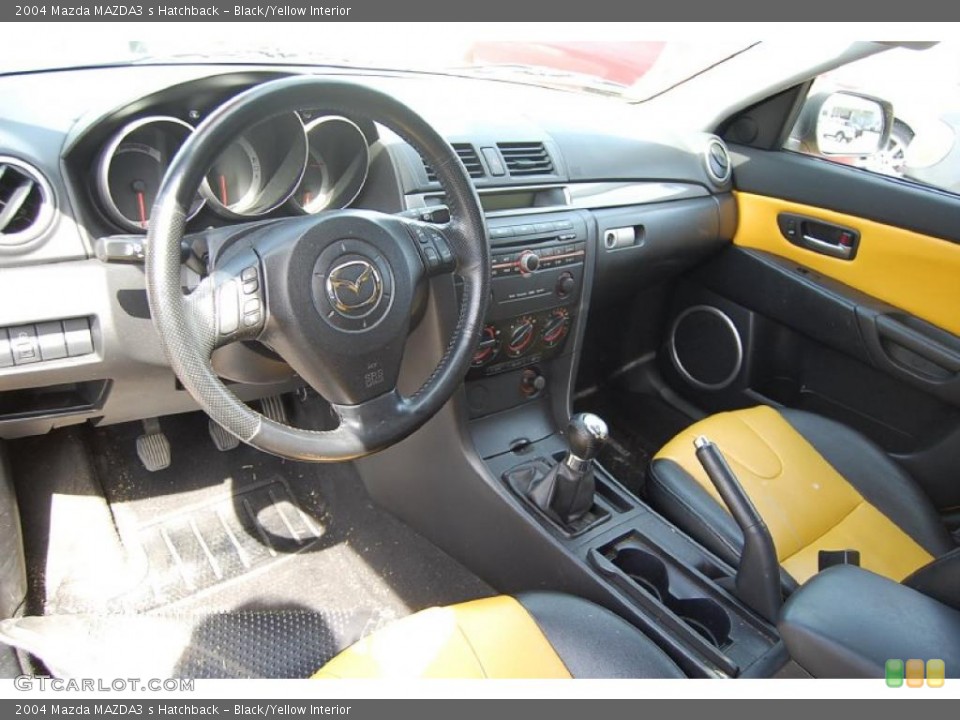 Black/Yellow Interior Prime Interior for the 2004 Mazda MAZDA3 s Hatchback #46668914