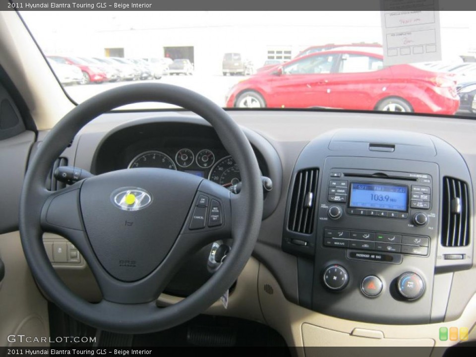 Beige Interior Dashboard for the 2011 Hyundai Elantra Touring GLS #46711315
