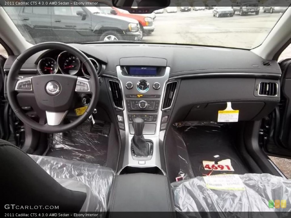 Ebony Interior Dashboard for the 2011 Cadillac CTS 4 3.0 AWD Sedan #46745308
