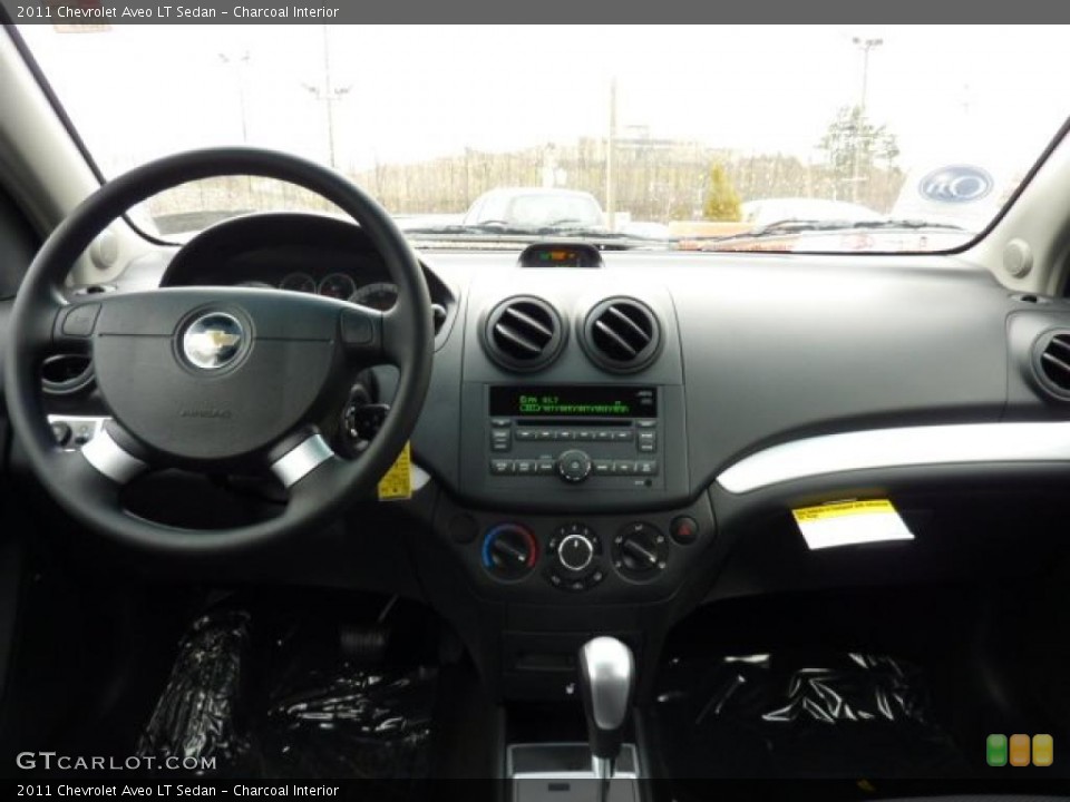 Charcoal Interior Dashboard for the 2011 Chevrolet Aveo LT Sedan #46845372
