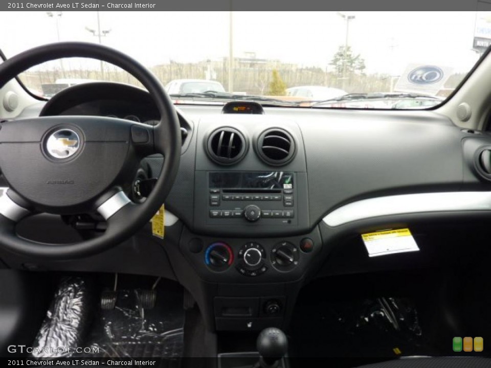 Charcoal Interior Dashboard for the 2011 Chevrolet Aveo LT Sedan #46845624