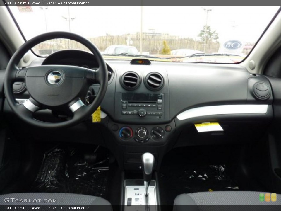 Charcoal Interior Dashboard for the 2011 Chevrolet Aveo LT Sedan #46847091