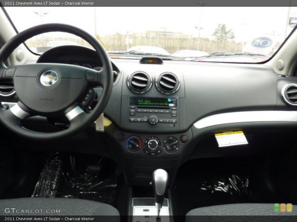 Charcoal Interior Dashboard for the 2011 Chevrolet Aveo LT Sedan #46848318