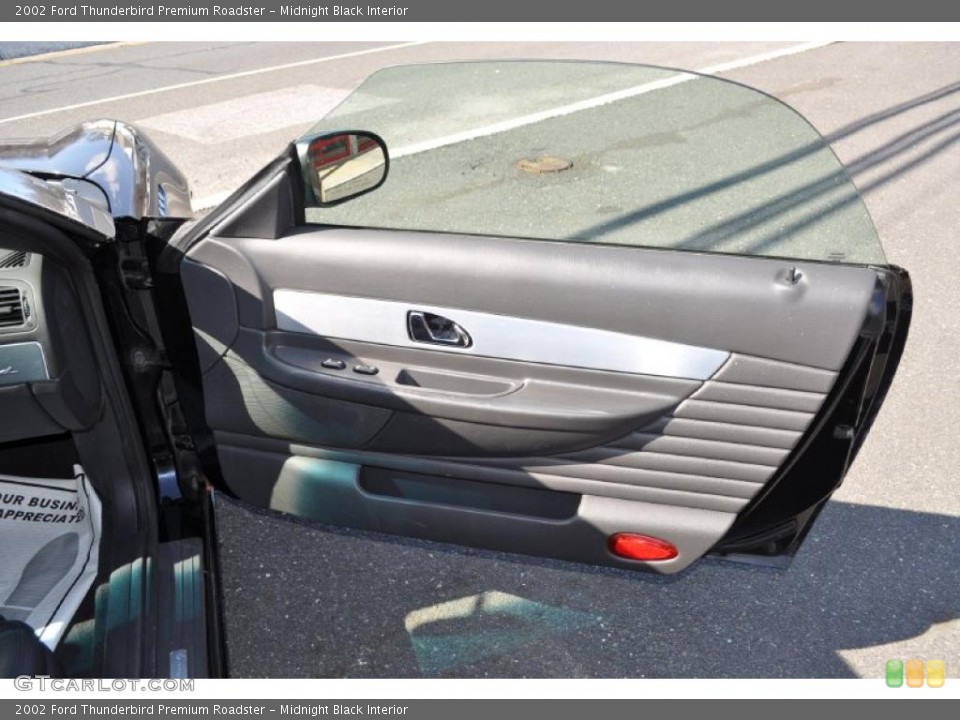 Midnight Black Interior Door Panel for the 2002 Ford Thunderbird Premium Roadster #46943175