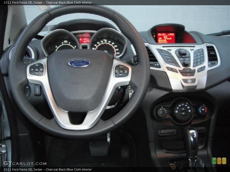 Charcoal Black/Blue Cloth Interior Dashboard for the 2011 Ford Fiesta SEL Sedan #46953408