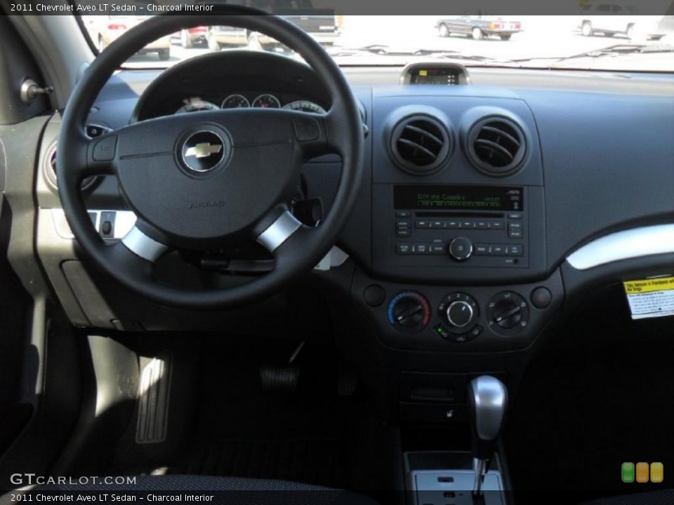 Charcoal Interior Dashboard for the 2011 Chevrolet Aveo LT Sedan #46964070