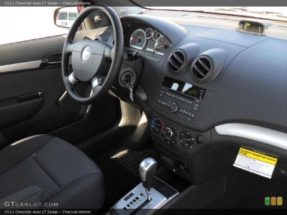 Charcoal Interior Dashboard for the 2011 Chevrolet Aveo LT Sedan #46964151