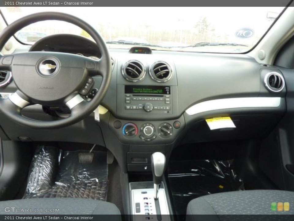 Charcoal Interior Dashboard for the 2011 Chevrolet Aveo LT Sedan #47008179