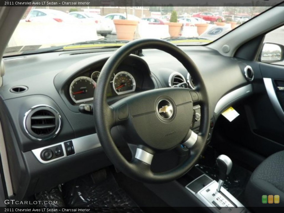 Charcoal Interior Steering Wheel for the 2011 Chevrolet Aveo LT Sedan #47008254