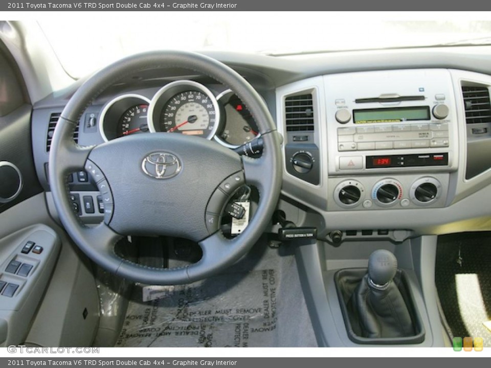 Graphite Gray Interior Dashboard for the 2011 Toyota Tacoma V6 TRD Sport Double Cab 4x4 #47074838