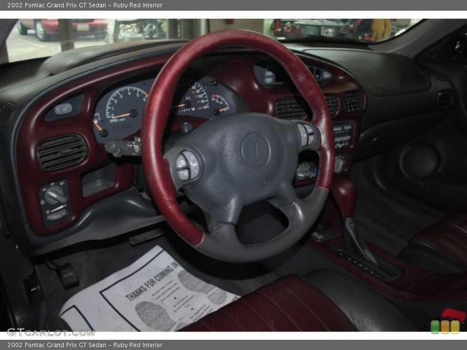 Ruby Red Interior Steering Wheel for the 2002 Pontiac Grand Prix GT Sedan #47090603