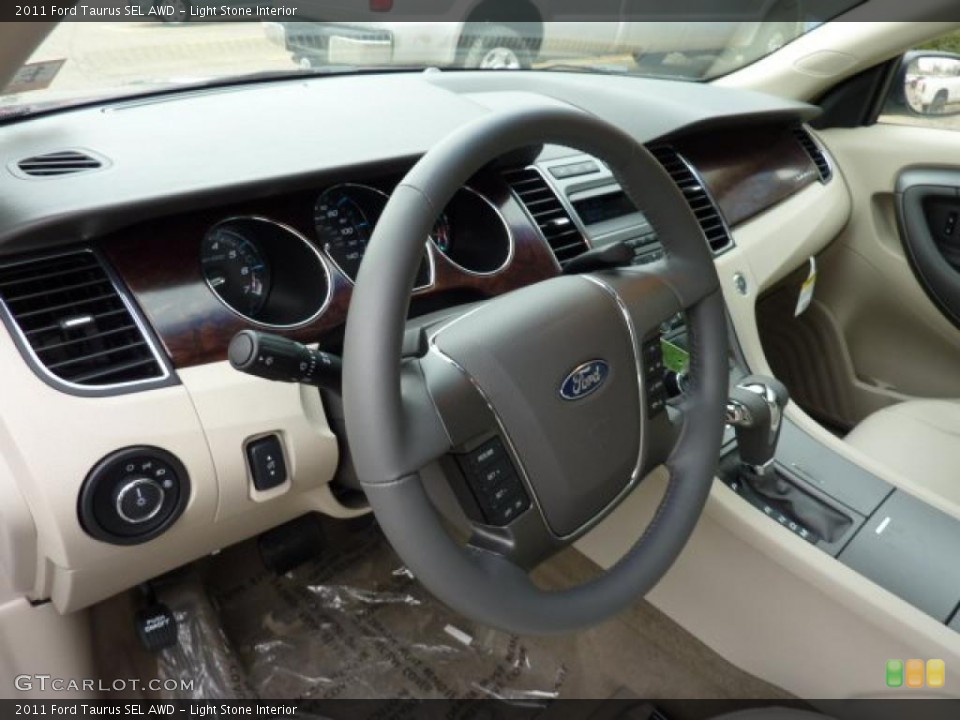 Light Stone Interior Steering Wheel for the 2011 Ford Taurus SEL AWD #47172993