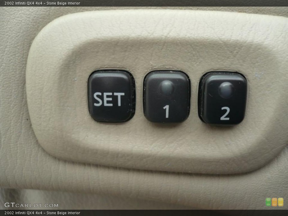 Stone Beige Interior Controls for the 2002 Infiniti QX4 4x4 #47186703
