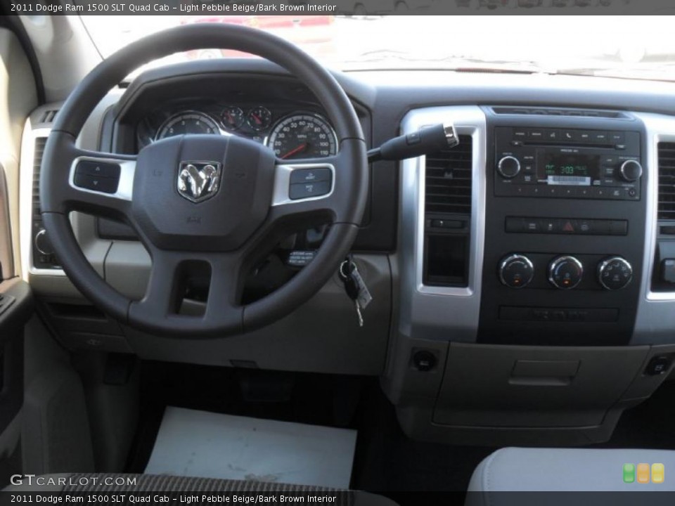 Light Pebble Beige/Bark Brown Interior Dashboard for the 2011 Dodge Ram 1500 SLT Quad Cab #47219438