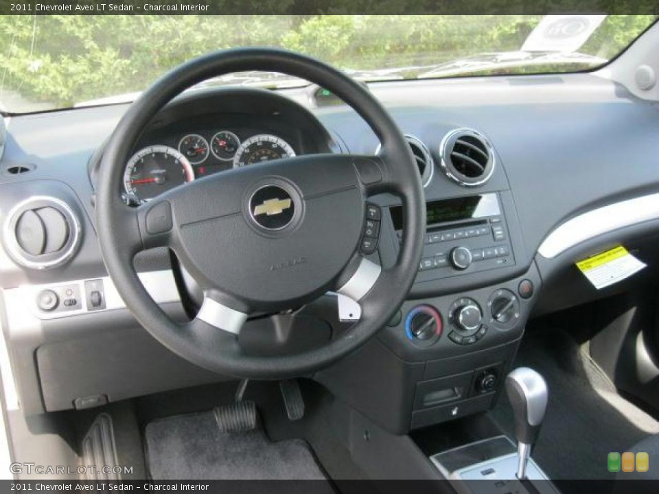 Charcoal Interior Dashboard for the 2011 Chevrolet Aveo LT Sedan #47244263
