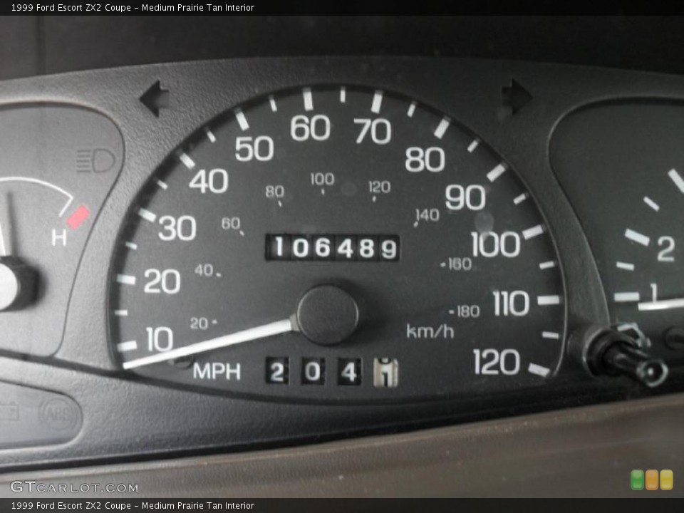 Medium Prairie Tan Interior Gauges for the 1999 Ford Escort ZX2 Coupe #47382521