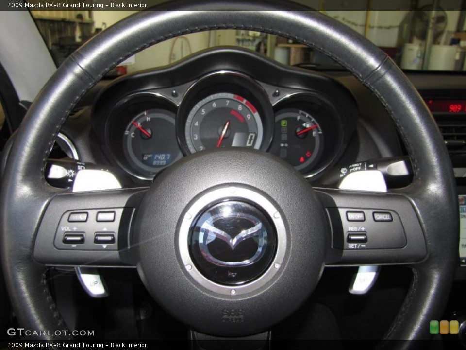 Black Interior Steering Wheel for the 2009 Mazda RX-8 Grand Touring #47472352
