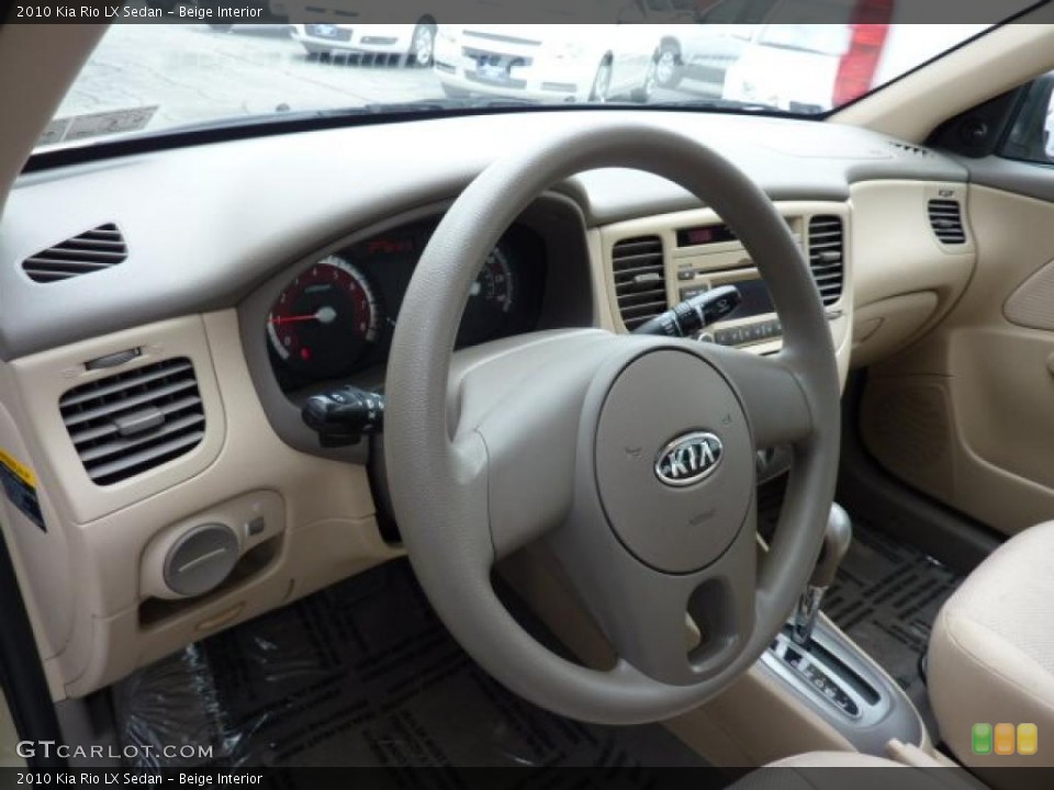 Beige Interior Steering Wheel for the 2010 Kia Rio LX Sedan #47550575
