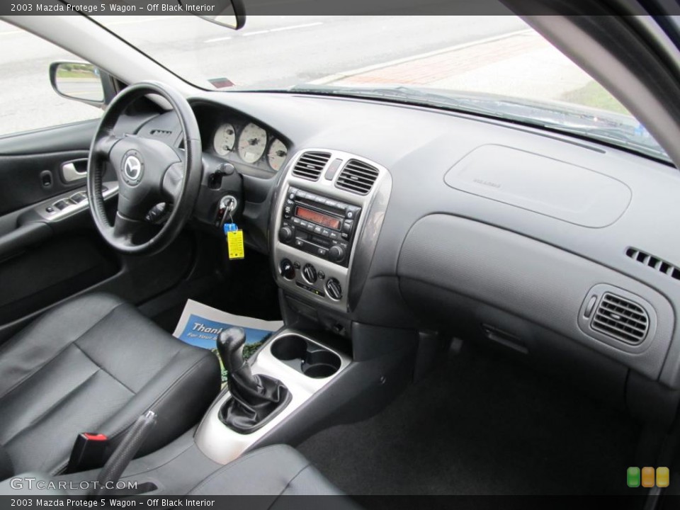 Off Black Interior Dashboard for the 2003 Mazda Protege 5 Wagon #47587711