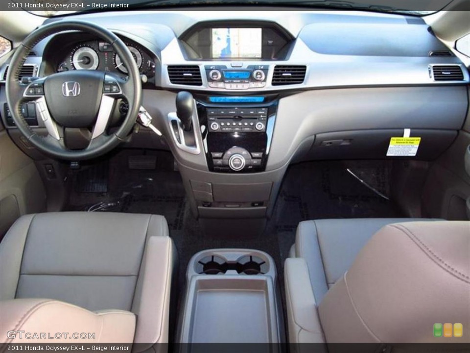Beige Interior Dashboard for the 2011 Honda Odyssey EX-L #47610698