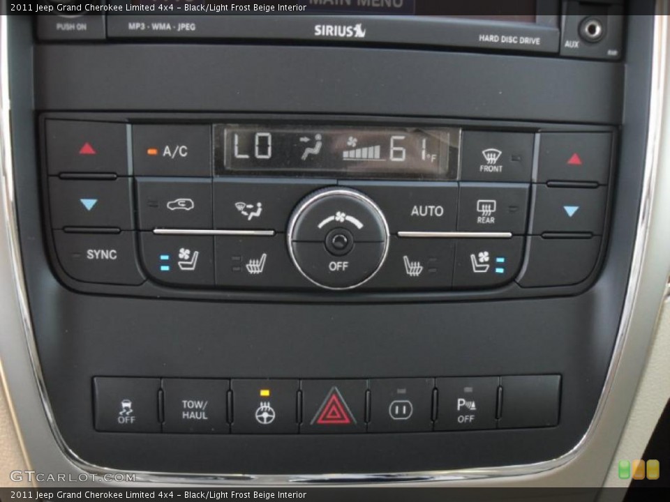 Black/Light Frost Beige Interior Controls for the 2011 Jeep Grand Cherokee Limited 4x4 #47738470