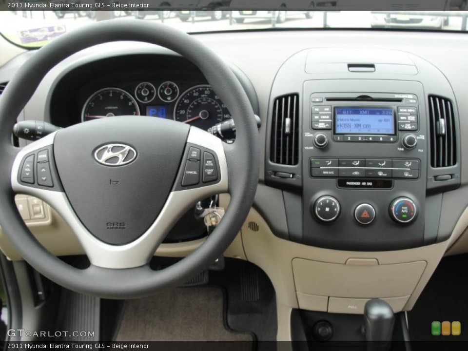 Beige Interior Dashboard for the 2011 Hyundai Elantra Touring GLS #47882138