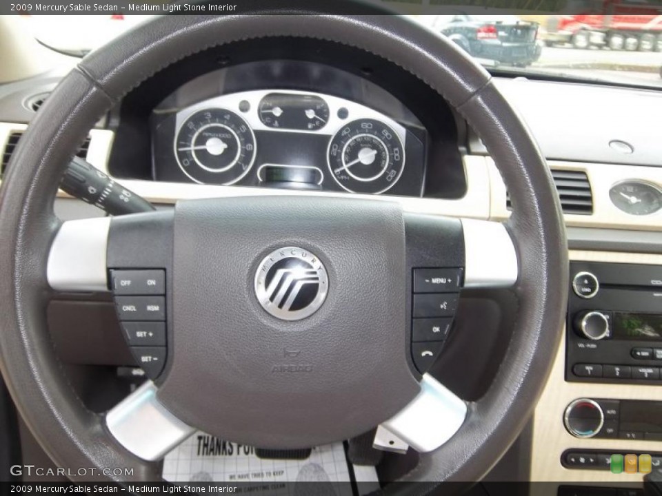 Medium Light Stone Interior Steering Wheel for the 2009 Mercury Sable Sedan #47913312