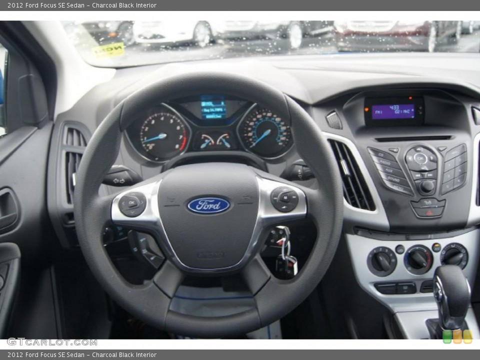 Charcoal Black Interior Steering Wheel for the 2012 Ford Focus SE Sedan #47956206