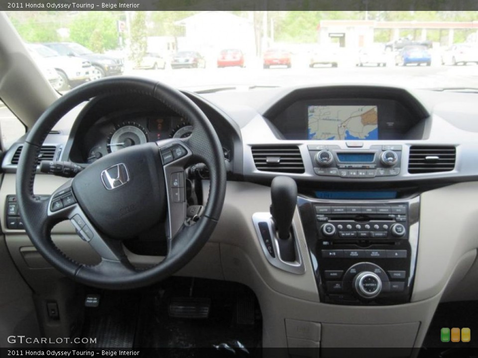 Beige Interior Dashboard for the 2011 Honda Odyssey Touring #48004578