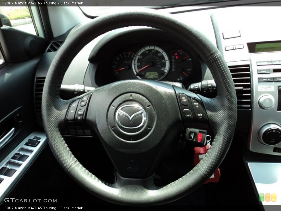 Black Interior Steering Wheel for the 2007 Mazda MAZDA5 Touring #48045373