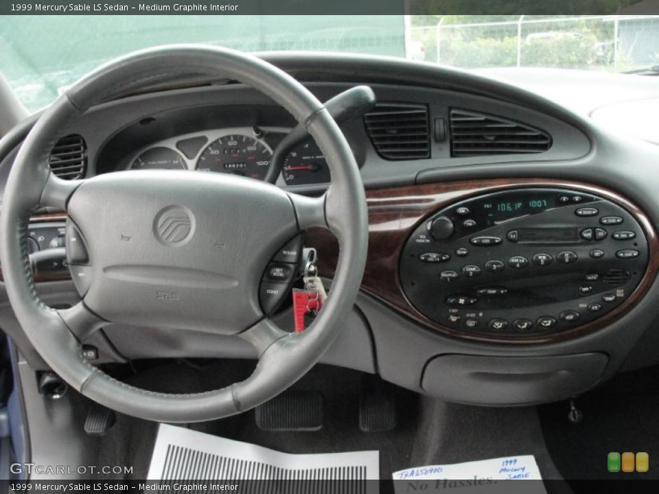 Medium Graphite Interior Dashboard for the 1999 Mercury Sable LS Sedan #48053762