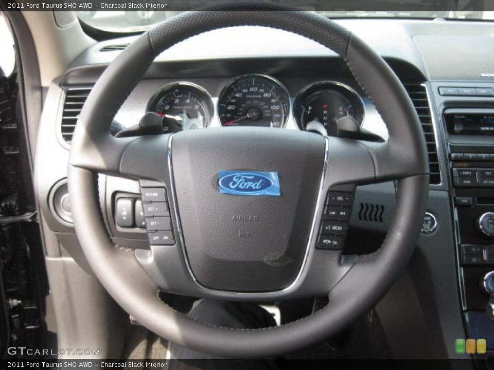 Charcoal Black Interior Steering Wheel for the 2011 Ford Taurus SHO AWD #48159557