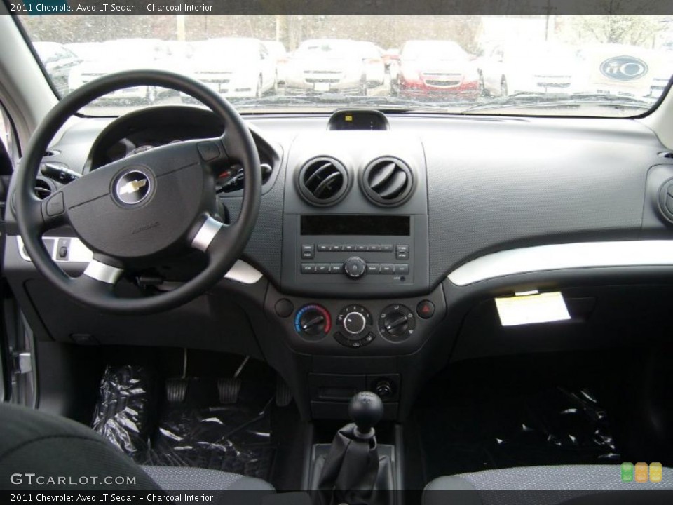 Charcoal Interior Dashboard for the 2011 Chevrolet Aveo LT Sedan #48339736