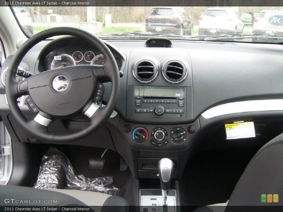 Charcoal Interior Dashboard for the 2011 Chevrolet Aveo LT Sedan #48340936