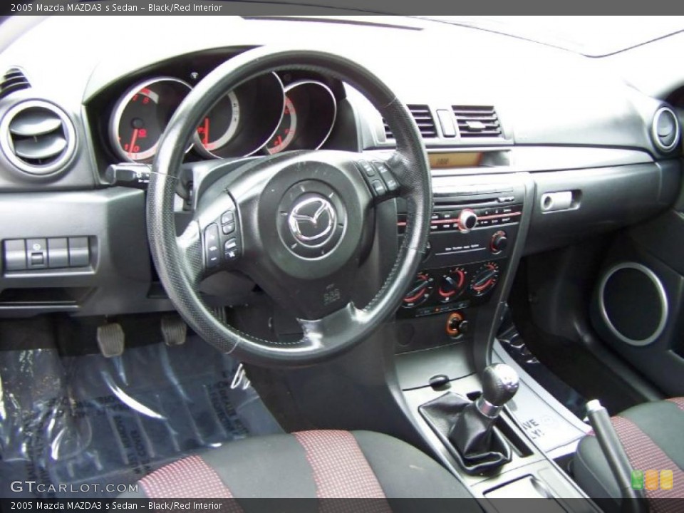 Black/Red Interior Photo for the 2005 Mazda MAZDA3 s Sedan #48392628
