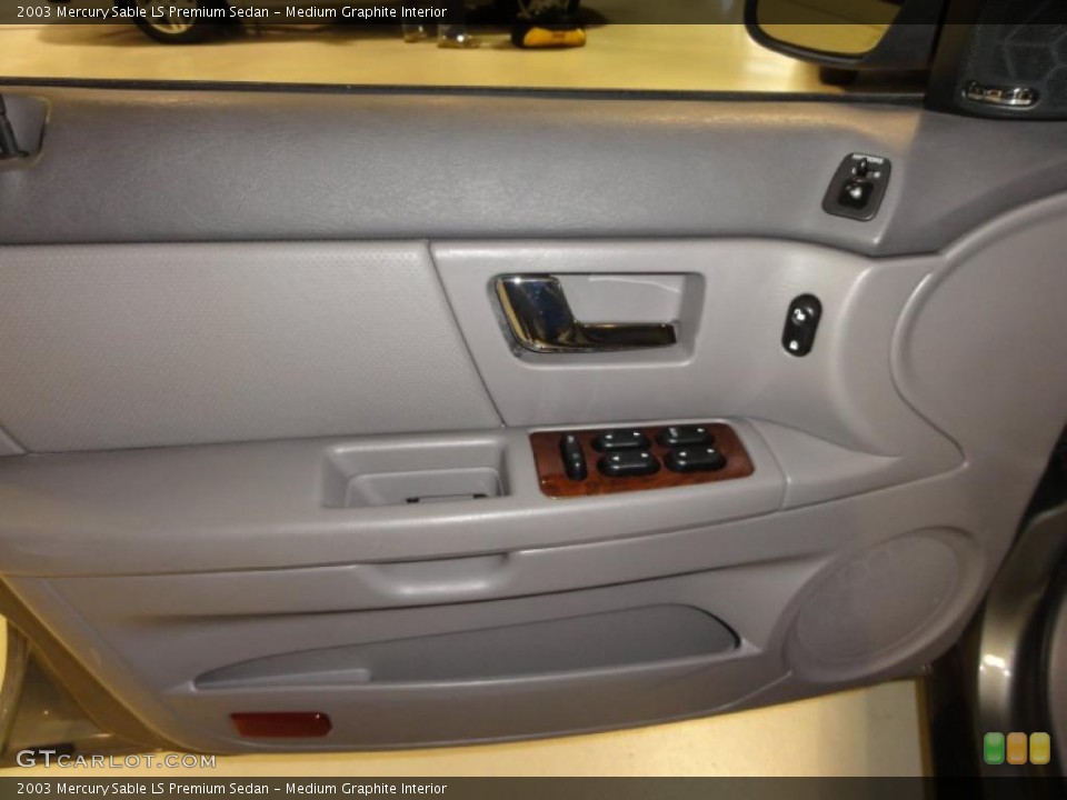 Medium Graphite Interior Door Panel for the 2003 Mercury Sable LS Premium Sedan #48448086